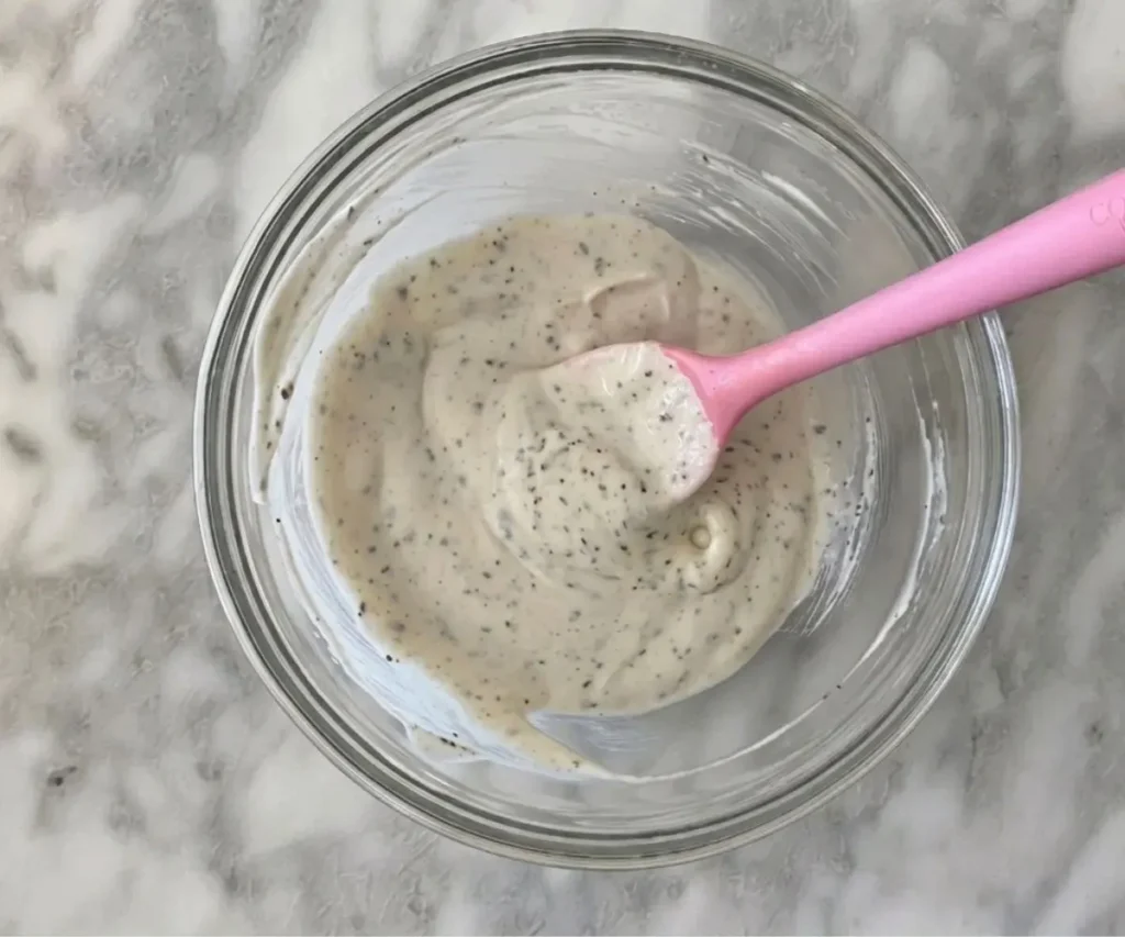 Creamy mayonnaise dressing for chicken salad in a glass bowl